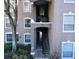 Exterior view of building 7147 and staircase entrance at 7147 Yacht Basin Ave # 115, Orlando, FL 32835