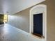A cozy front door entrance with a blue door, white trim, and neutral textured walls at 7147 Yacht Basin Ave # 115, Orlando, FL 32835
