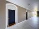 Exterior hallway features numbered apartment doors and textured walls, providing a clear path at 7147 Yacht Basin Ave # 115, Orlando, FL 32835