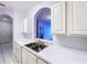 Kitchen sink with view into living area at 7147 Yacht Basin Ave # 115, Orlando, FL 32835