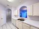 Kitchen with white countertops, cabinets, and a view to the living room at 7147 Yacht Basin Ave # 115, Orlando, FL 32835