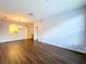 Open living room with wood floors and neutral walls at 7147 Yacht Basin Ave # 115, Orlando, FL 32835