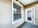 Enjoy outdoor living on this private patio with window and glass door for natural light at 7147 Yacht Basin Ave # 115, Orlando, FL 32835