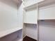 Spacious walk-in closet with custom shelving and hanging rods provides ample storage at 7147 Yacht Basin Ave # 115, Orlando, FL 32835