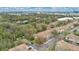 Aerial view of residential townhomes surrounded by mature trees and landscaping at 7159 Cadiz Blvd, Orlando, FL 32819