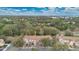 Aerial view of residential townhomes amidst a canopy of lush trees at 7159 Cadiz Blvd, Orlando, FL 32819