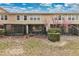 Rear exterior view of home highlighting a screened lanai and well-manicured landscaping at 7159 Cadiz Blvd, Orlando, FL 32819