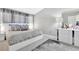 A stylish bedroom featuring a modern platform bed, elegant decor, and soft, filtered natural light at 7159 Cadiz Blvd, Orlando, FL 32819