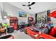 Eclectic bedroom with a race car bed, entertainment center, and playful decor throughout at 7159 Cadiz Blvd, Orlando, FL 32819