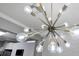 Close up on a stylish and modern chandelier fixture at 7159 Cadiz Blvd, Orlando, FL 32819