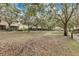 View of community grounds with mature trees and well-maintained landscaping at 7159 Cadiz Blvd, Orlando, FL 32819