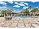 Inviting community pool featuring a relaxing seating area and lush landscaping at 7159 Cadiz Blvd, Orlando, FL 32819