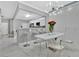 Chic dining area with modern chandelier, textured walls, and a marble floor at 7159 Cadiz Blvd, Orlando, FL 32819
