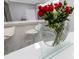 Dining area featuring a modern bouquet of flowers with bar seating in the background at 7159 Cadiz Blvd, Orlando, FL 32819