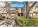 Charming townhome with a garage, lush landscaping, and a welcoming entrance at 7159 Cadiz Blvd, Orlando, FL 32819
