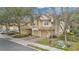 Attractive townhome with a two-car garage and well-maintained landscaping at 7159 Cadiz Blvd, Orlando, FL 32819