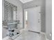 Elegant foyer featuring marble floors, decorative mirror, and modern console table at 7159 Cadiz Blvd, Orlando, FL 32819