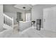 Welcoming foyer features marble floors, decorative mirror, and modern furniture at 7159 Cadiz Blvd, Orlando, FL 32819