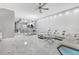 Spacious living room features a white sectional sofa, marble floors, and bar seating at 7159 Cadiz Blvd, Orlando, FL 32819
