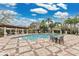 Inviting community pool area with comfortable lounge chairs and shaded seating for outdoor enjoyment at 7159 Cadiz Blvd, Orlando, FL 32819
