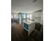 Kitchen featuring island with marble countertop and lots of storage space at 7187 Wild Strawberry Run, Winter Garden, FL 34787