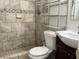 Nicely-tiled bathroom featuring a modern vanity and a step-in shower at 7200 Ravenna Ave, Orlando, FL 32819