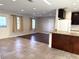 Open-concept living room with tile and wood flooring, and access to the kitchen at 7200 Ravenna Ave, Orlando, FL 32819