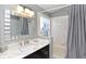 Modern bathroom with marble countertop vanity and a shower/tub combo at 7952 Heritage Entrance Blvd, Kissimmee, FL 34747