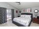 Comfortable bedroom featuring a queen-size bed, sliding glass door, and stylish decor at 7952 Heritage Entrance Blvd, Kissimmee, FL 34747