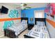 Themed bedroom with twin beds, ceiling fan, and blue and orange decor at 7952 Heritage Entrance Blvd, Kissimmee, FL 34747