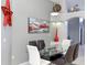 Well-decorated dining area with modern table and chairs, art, and decor at 7952 Heritage Entrance Blvd, Kissimmee, FL 34747