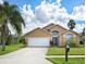 Charming single-Gathering home with a well-manicured lawn and a two-car garage at 7952 Heritage Entrance Blvd, Kissimmee, FL 34747