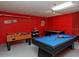 Spacious game room featuring a pool table, foosball table, and various games at 7952 Heritage Entrance Blvd, Kissimmee, FL 34747
