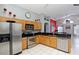 Spacious kitchen with wood cabinets, stainless steel appliances, and tiled floors at 7952 Heritage Entrance Blvd, Kissimmee, FL 34747