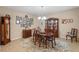 Elegant dining room with hardwood furniture, decorative rug, and chandelier, perfect for Gathering gatherings at 8137 Surf Bird St, Winter Garden, FL 34787