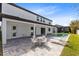 Backyard featuring a pool, patio, and a covered outdoor dining area for entertainment at 8390 Ludington Cir, Orlando, FL 32836
