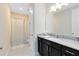 Bathroom featuring vanity with granite countertop and shower with decorative curtain at 8390 Ludington Cir, Orlando, FL 32836