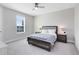 Bright bedroom with a comfortable bed, neutral color palette, and a large window at 8390 Ludington Cir, Orlando, FL 32836