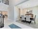 This dining room features an elegant chandelier, dining table with chairs, and modern decor at 8390 Ludington Cir, Orlando, FL 32836