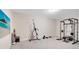 Home exercise room featuring modern workout equipment and neutral colors at 8390 Ludington Cir, Orlando, FL 32836