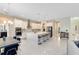 Open-concept kitchen with stainless steel appliances, a large island, and modern fixtures at 8390 Ludington Cir, Orlando, FL 32836