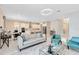 Bright, open-concept living space with modern furnishings, tile floors, and plenty of natural light at 8390 Ludington Cir, Orlando, FL 32836