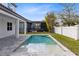 An inviting backyard pool is ideal for relaxation with an extended patio at 8390 Ludington Cir, Orlando, FL 32836