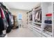This amazing walk-in closet has plenty of shelving and racks for maximum storage capability at 8390 Ludington Cir, Orlando, FL 32836