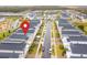 Aerial view of a neighborhood, pinpointing the house location with a distinct marker at 8824 Cruden Bay Ct, Davenport, FL 33896