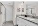 A bathroom featuring dual sinks, modern fixtures, a shower, and a separate toilet room at 8824 Cruden Bay Ct, Davenport, FL 33896