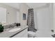 Full bathroom with a sleek vanity, contemporary fixtures, tub, and shower with a shower curtain at 8824 Cruden Bay Ct, Davenport, FL 33896