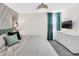 Bedroom featuring a queen bed, dresser, TV, and modern decor at 8824 Cruden Bay Ct, Davenport, FL 33896