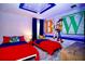 Toy Story-themed bedroom featuring two twin beds, character decor, and a decorative ceiling at 8824 Cruden Bay Ct, Davenport, FL 33896
