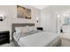 Neutral bedroom with art and sconces, offering a relaxing space at 8824 Cruden Bay Ct, Davenport, FL 33896